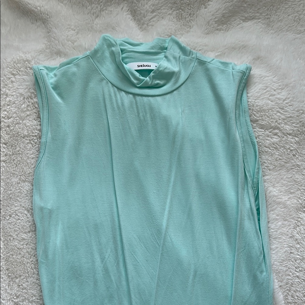 The Sak Blue Sleeveless Bodysuit with Mandarin Collar